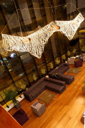an overhead view of a living room with a chandelier at Crowne Plaza Lima by IHG in Lima