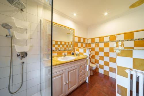 a bathroom with a sink and a shower at E415 Can Xisco by Mallorca Villa Selection in Port de Pollensa