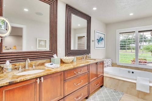 a bathroom with a tub and a sink and a tub and a bath tub at Perfect Match on Baywood Lane in Wesley Chapel
