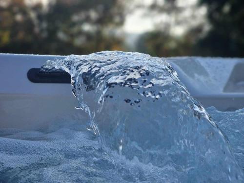 a splash of water in a pool of water at Hilltop House. in Erdut