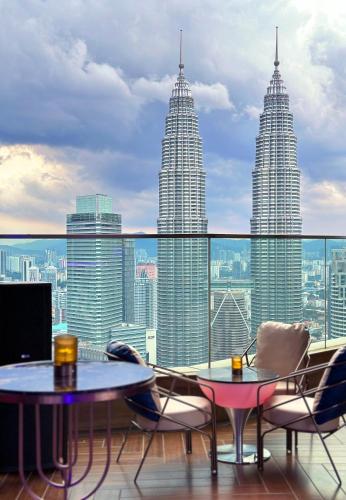 a view of the petronas twin skyscrapers from a balcony at Imperial Lexis Kuala Lumpur in Kuala Lumpur