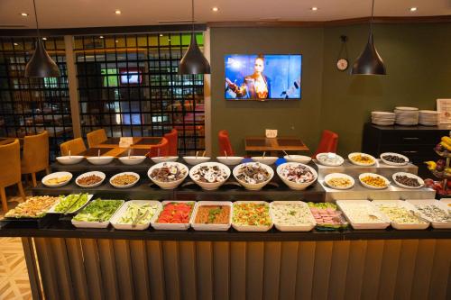 a buffet line with many different types of food at Boris Hotel Beylikdüzü in Beylikduzu