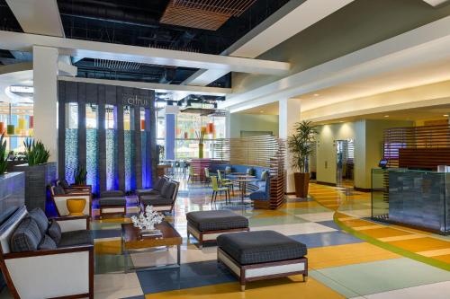 a lobby of a hotel with couches and chairs at Renaissance ClubSport Aliso Viejo Laguna Beach Hotel in Aliso Viejo