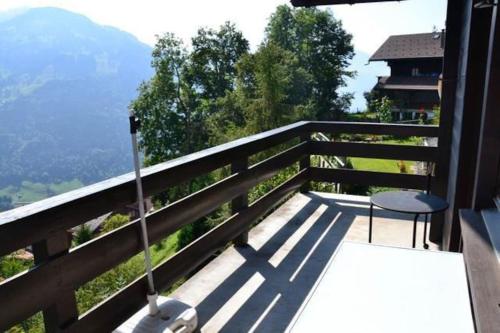 a balcony with two chairs and a view of a mountain at Chavonnes 21 in Gryon