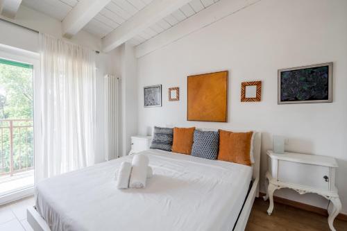 Ένα ή περισσότερα κρεβάτια σε δωμάτιο στο Porto di Mare Bilo & Mono Apartments