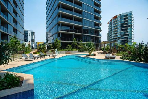 a swimming pool in the middle of a building at Resort Living 2BR with Pool Spa Gym & Parking in Brisbane