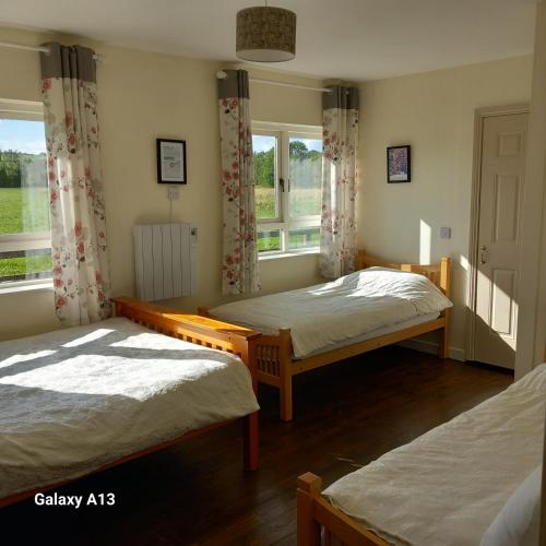 Ένα ή περισσότερα κρεβάτια σε δωμάτιο στο Ash House Bed and Breakfast