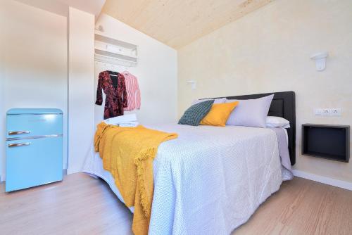 a bedroom with a large bed and a tv at RG Duque de Aveiro in Málaga