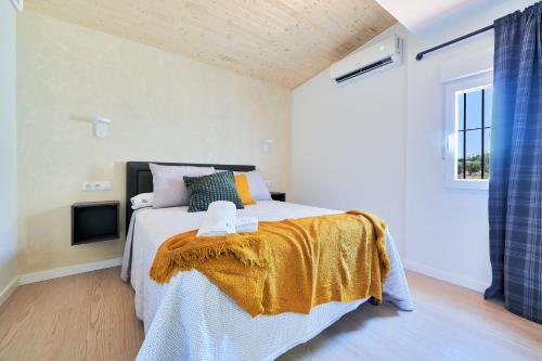 a bedroom with a large bed and a tv at RG Duque de Aveiro in Málaga