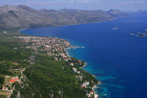 an aerial view of a town on the shore of a lake at Summer Park Residence Peljesac in Orebić