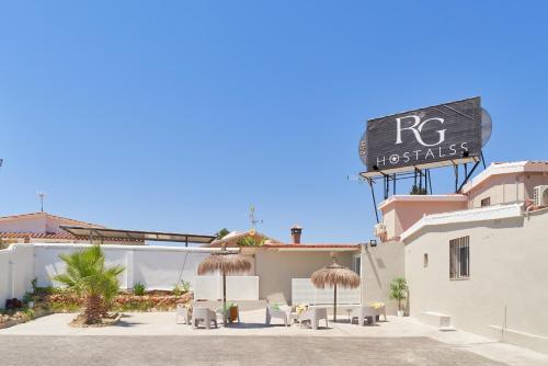 a building with a sign on the side of it at RG Duque de Aveiro in Málaga