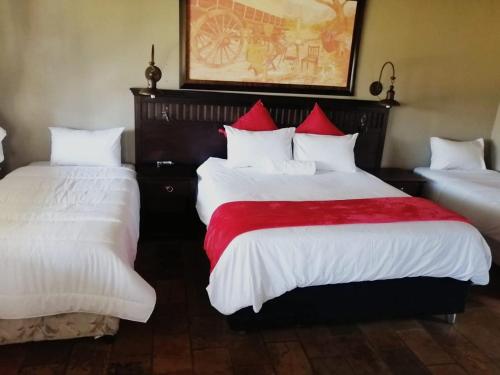 Ένα ή περισσότερα κρεβάτια σε δωμάτιο στο Pioneer lodge