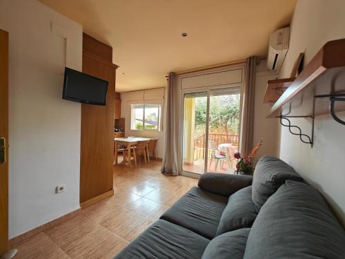 Televízia a/alebo spoločenská miestnosť v ubytovaní Apartamento Columbretes