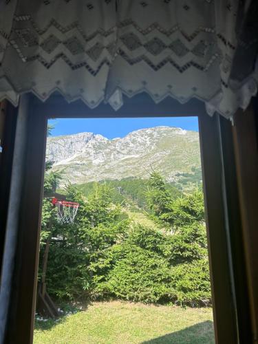 a view of a basketball hoop from a window at NV Mountain House in Žabljak