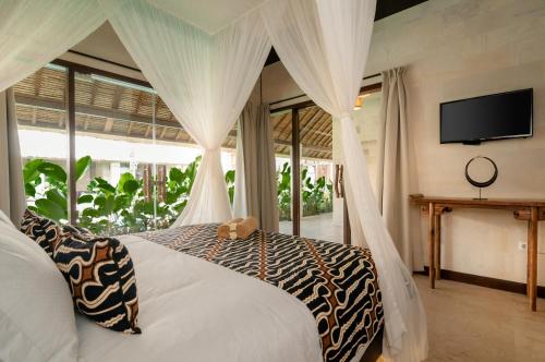 Karmagali Suites Adults only & Private Pool Family Villas tesisinde bir odada yatak veya yataklar