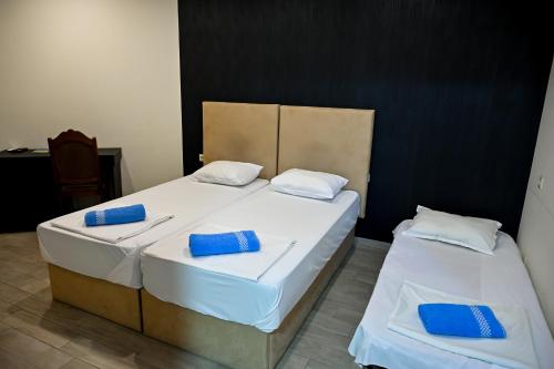 Voodi või voodid majutusasutuse Star Hotel toas