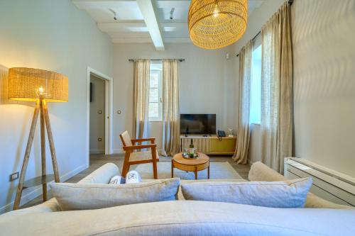 a living room with a couch and a table at Hotel Brattia, Adults Only, Heated Pool, A la Carte Breakfast, Postira, Brač Island in Postira