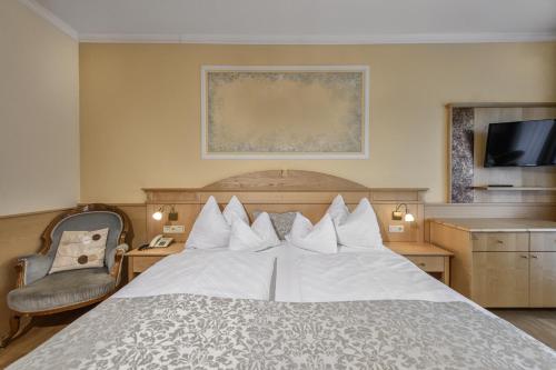 Ένα ή περισσότερα κρεβάτια σε δωμάτιο στο Hotel Alpenblick