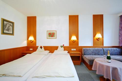 Posteľ alebo postele v izbe v ubytovaní Fleger Appartements