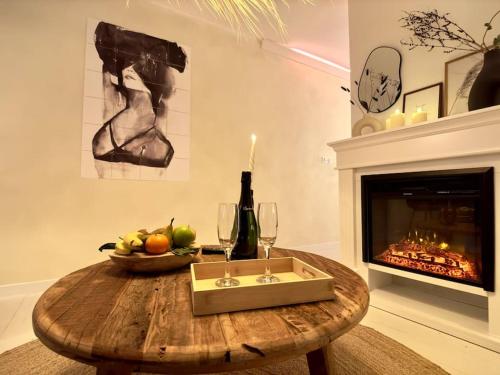 a living room with a table and a fireplace at Casa Love in Déville-lès-Rouen