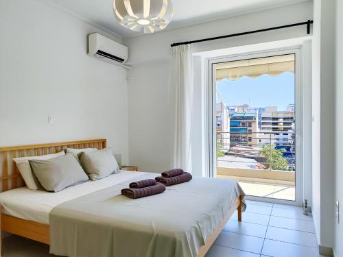 Posteľ alebo postele v izbe v ubytovaní KYMA Apartments - Athens Acropolis 14