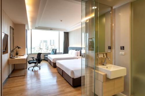 Postel nebo postele na pokoji v ubytování Jasmine Resort Bangkok