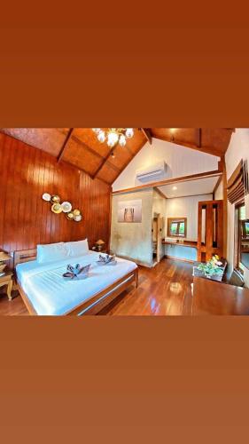 a bedroom with a large bed in a room at Little Rock Kohjum in Ko Jum