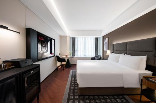 Postel nebo postele na pokoji v ubytování IntercityHotel Xi'an Dayan Pagoda by DH