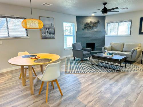 a living room with a table and a couch at 1BR Apt 7 mins Integris Monthly 15 Off #41B in Oklahoma City