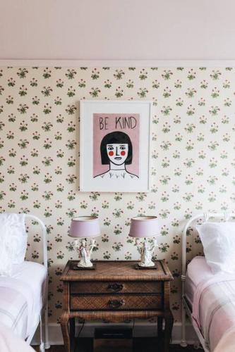 a bedroom with two beds and a table with two lamps at Seymour House in Moss Vale