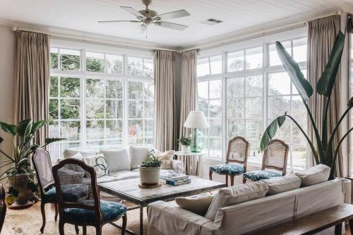 a living room with a couch and a table at Seymour House in Moss Vale