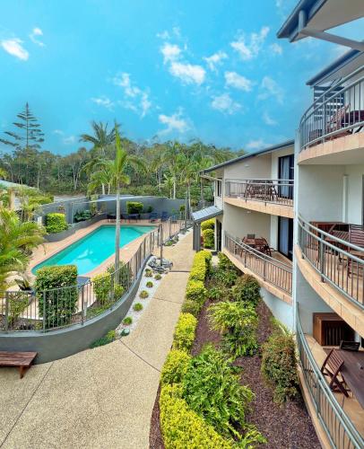 an aerial view of an apartment complex with a swimming pool at Beaches Holiday Resort in Port Macquarie