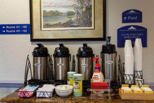 a counter top with a group of appliances on it at Microtel Inn and Suites by Wyndham - Lady Lake/ The Villages in The Villages
