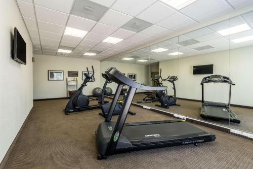 a gym with several exercise bikes in a room at Sleep Inn & Suites in Pleasanton