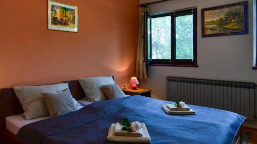 En eller flere senge i et værelse på Apartment ADAM