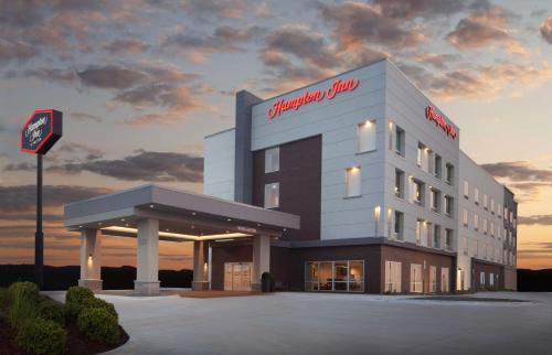 a building with a sign on the side of it at Hampton Inn Ogallala in Ogallala