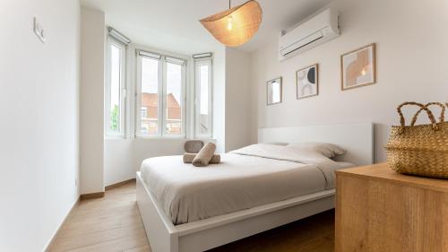 Postel nebo postele na pokoji v ubytování Villa Leone - Appart à 500m de la plage de Malo