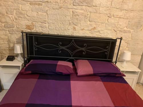 Ένα ή περισσότερα κρεβάτια σε δωμάτιο στο ANTICA DIMORA casa vacanze