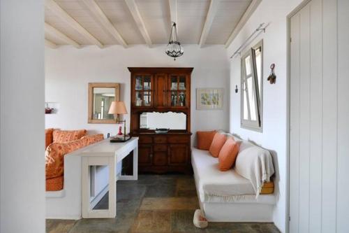 a living room with a couch and a table at Villa Ourania in Kampos Paros