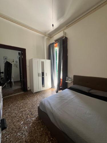 a bedroom with a bed and a large mirror at Mylittlehouse in Messina