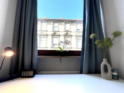 Postel nebo postele na pokoji v ubytování Zentrales City-Studio in Mannheimer Innenstadt