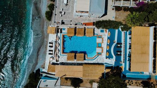 an aerial view of a resort next to the ocean at SPONGIA HOTEL SUITES & Spa in Myrties