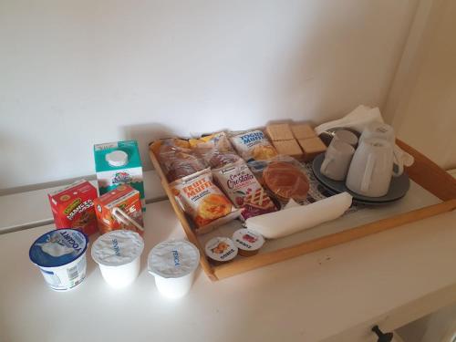 a shelf with food and other food items on it at A Casa dei Bruno B&B in Pozzuoli