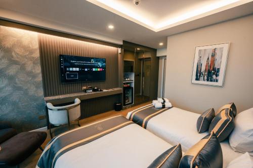 Televisyen dan/atau pusat hiburan di Bestier Hotel Hatyai