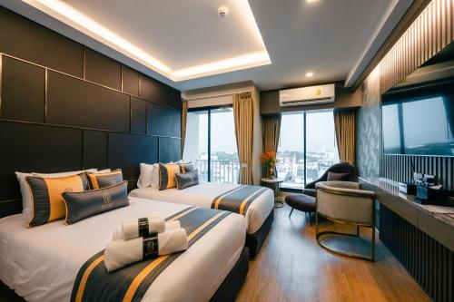 Ένα ή περισσότερα κρεβάτια σε δωμάτιο στο Bestier Hotel Hatyai