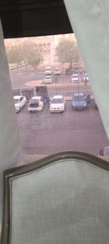 a view of cars parked in a parking lot at Home Away Apartment in Abu Dhabi