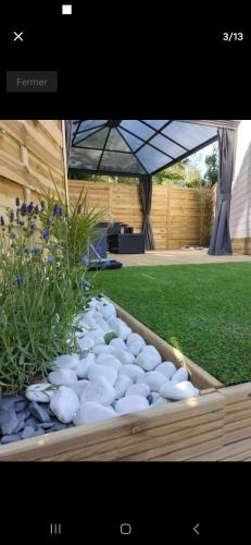a garden with rocks and plants in a box at Logement calme in Berck-sur-Mer