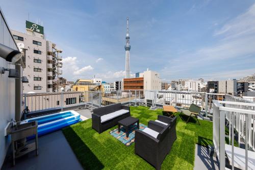 a balcony with a view of a city at Walk to Asakusa, Sky tree MAX16P in Tokyo