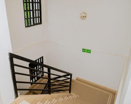 Postel nebo postele na pokoji v ubytování Igitego Boutique Hotel LTD