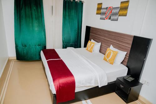 Postel nebo postele na pokoji v ubytování Igitego Boutique Hotel LTD
